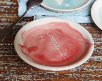 white earthenware dessert plate with raspberry pink or celadon blue stain