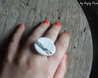 Oval white unglazed porcelain with line pattern
