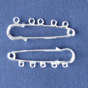 2 support silver plated kilt pin brooch