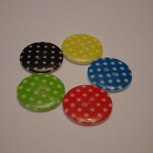 Cinq boutons de couleurs à pois blancs