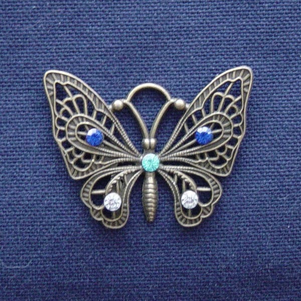 Breloque Papillon en métal bronze strass bleu/turquoise/argent