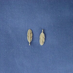 2 charmes bronze veren