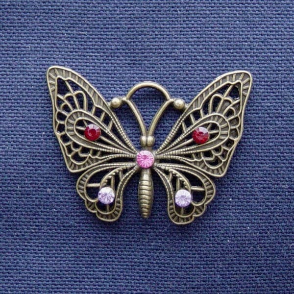 Breloque Papillon en métal bronze strass rouge/rose/parme clair