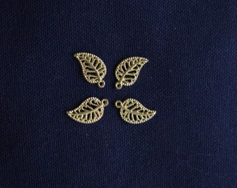 4 small gold leaf charms