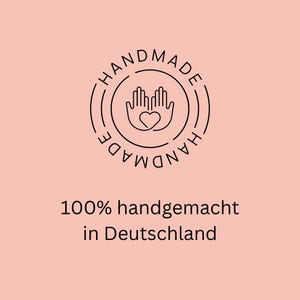 May include: Black and white logo with two hands holding a heart in the center of a circle. The text "HANDMADE" is written around the circle in a circular pattern. Below the logo, the text reads "100% handgemacht in Deutschland."