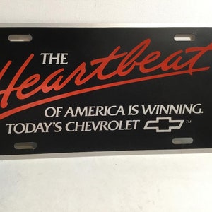 Vintage Chevrolet License Plate, &quot;The Heartbeat of America I Winning, Today&#39;s Chevrolet&quot; New 1980&#39;s