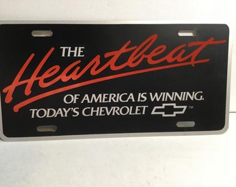Vintage Chevrolet License Plate, &quot;The Heartbeat of America I Winning, Today&#39;s Chevrolet&quot; New 1980&#39;s