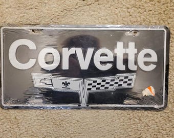 Vintage Corvette License Plates. Chevrolet Corvette Checkered Flag Grill Embossed License Plates . NEW Old Stock Corvette License Plates.