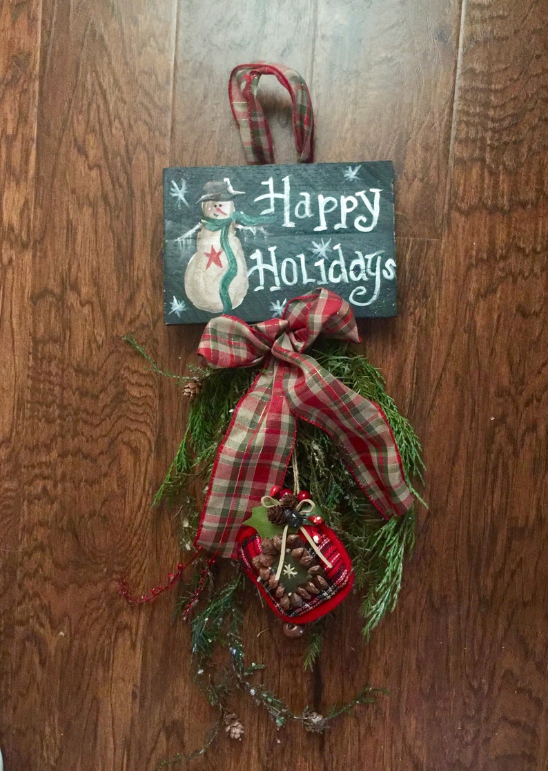 Farmhouse Christmas swag with snowman sign and fresh preserved evergreen