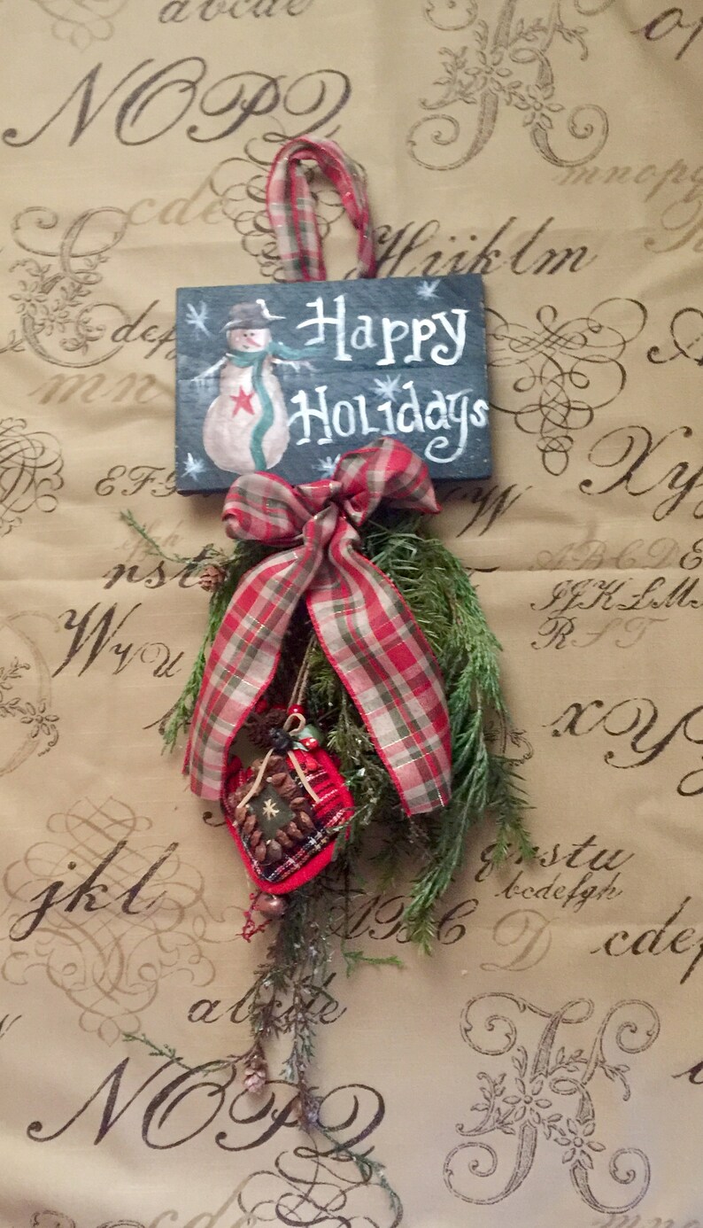 Farmhouse Christmas swag with snowman sign and fresh preserved evergreen