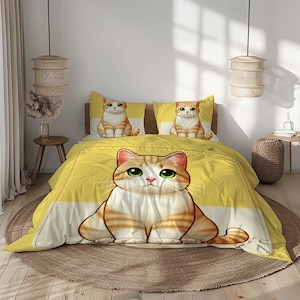 May include: A yellow and white cat-themed duvet cover set with a large cartoon cat on the duvet and smaller cats on the pillowcases. The set includes a duvet cover and two pillowcases. The bedding is designed for a bed.
