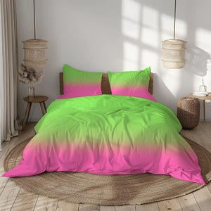 May include: A bed with a vibrant neon green and pink ombre duvet cover and two matching pillowcases. The bedding is arranged on a wooden bed frame, creating a modern and colorful bedroom aesthetic. The room is decorated with natural elements.