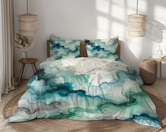 May include: A bed with a green and blue watercolor duvet cover and matching pillowcases. The bedding features a swirling abstract pattern.