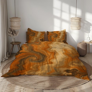 May include: A bed with a duvet cover and two pillowcases. The bedding features a swirling pattern in shades of orange, brown, and tan. The bed is on a round, woven rug.