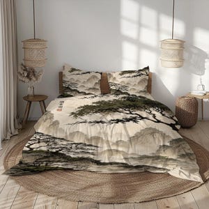 May include: A bedding set featuring a beige duvet cover and two matching pillowcases with a printed landscape design of dark green pine trees and misty mountains. The fabric includes a small vertical column of black Chinese characters.