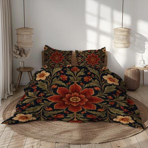 May include: A bedding set featuring a dark background with a large, symmetrical floral pattern in shades of deep red, orange, and muted green. The set includes a duvet cover and two matching pillow shams, all displaying the same intricate botanical design.
