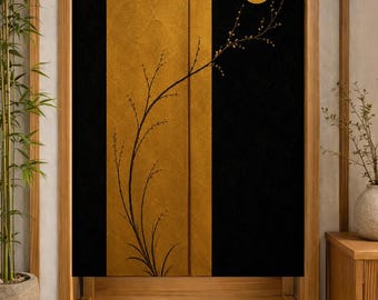 May include: A rectangular fabric door curtain featuring a split design with a central vertical panel of textured gold leaf and flanking black panels. A black silhouette of a slender, budding branch extends across the gold and black sections toward a solid gold circular moon in the upper right corner.
