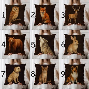 May include: Nine decorative throw pillows with animal illustrations. The pillows feature images of an owl, fox, deer, bear, wolf, rabbit, bulldog, cat, and a collie. Each pillow has a dark brown background and a detailed animal portrait.