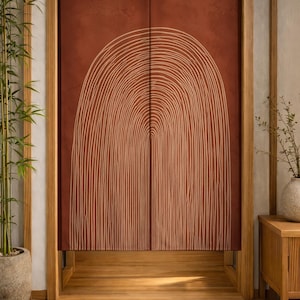 May include: A rectangular fabric door curtain featuring a deep terracotta red background with a large, centered white line art graphic of a tall, narrow archway. The curtain is split down the middle and hangs within a wooden door frame.