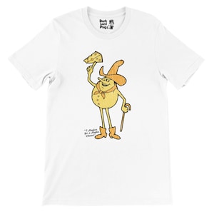 May include: White t-shirt featuring a cartoon character holding a cheese wedge. The character wears a cowboy hat, boots, and a neckerchief. The text "I Hanker for a Hanks Cheese!" is below the character. The Dark Lord Pugs logo is at the top.