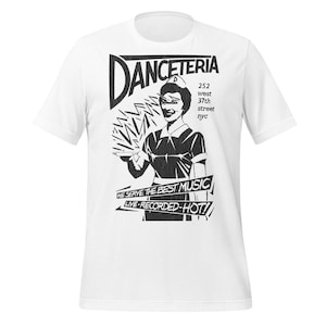 May include: White t-shirt with a black and white graphic. The graphic features the word "Danceteria" above an illustration of a server holding a tray. Below the server is the text "We serve the best music live-recorded-hot!!"