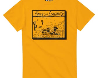 May include: Mustard yellow t-shirt featuring a black and white graphic from "Fear and Loathing". The graphic includes the title, desert imagery, and a quote. The shirt has a crew neck and short sleeves.