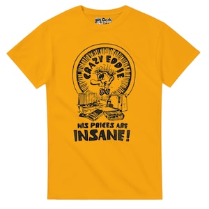 May include: Mustard yellow t-shirt with a black graphic of a cartoon character, the text "CRAZY EDDIE" and "HIS PRICES ARE INSANE!". The tee has short sleeves and a crew neck.