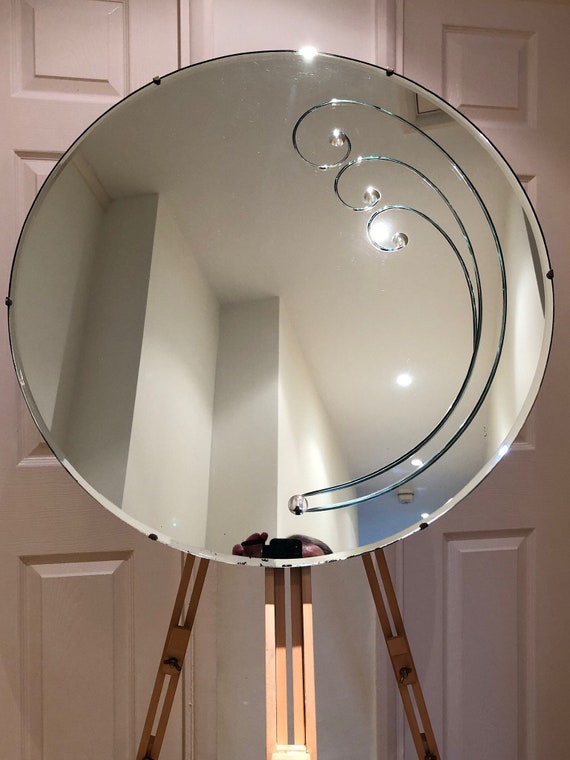 A Round Bevelled Edge Vintage Mirror A Round Bevelled Edge Vintage Mirror
