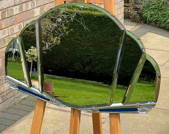 Deco mirror with metal fitments