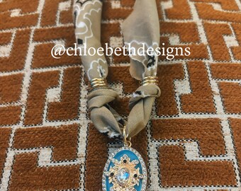 Scarf necklace: tan beige neutral black pattern scarf, gold teal blue ornate pave charm, chunky statement necklace jewelry fall trendy