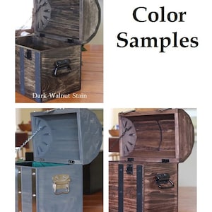 May include: Three wooden treasure chests with different stain colors: Dark Walnut Stain, Carbon Grey, and Red Mahogany. Each chest has a hinged lid, a metal latch, and a metal chain.