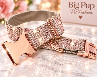 May include: A pet collar covered in light pink rhinestones with a rose gold metal buckle and hardware. The collar features a side-release clasp and a D-ring. A white box in the background displays the text Big Pup Pet Fashion with a heart icon.