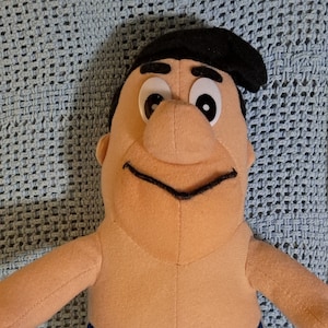 1994 vintage Fred Flintstone Play by Play NFL football crane prize plush Hanna Barbera Lions Panthers Cowboys no shirt