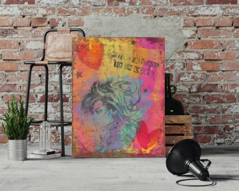 May include: An abstract art print with a distressed effect, featuring a woman's face, hearts, and stars. The artwork includes the words "I'M IN LOVE" in a stencil font. The colour palette includes pink, yellow, orange, and blue.