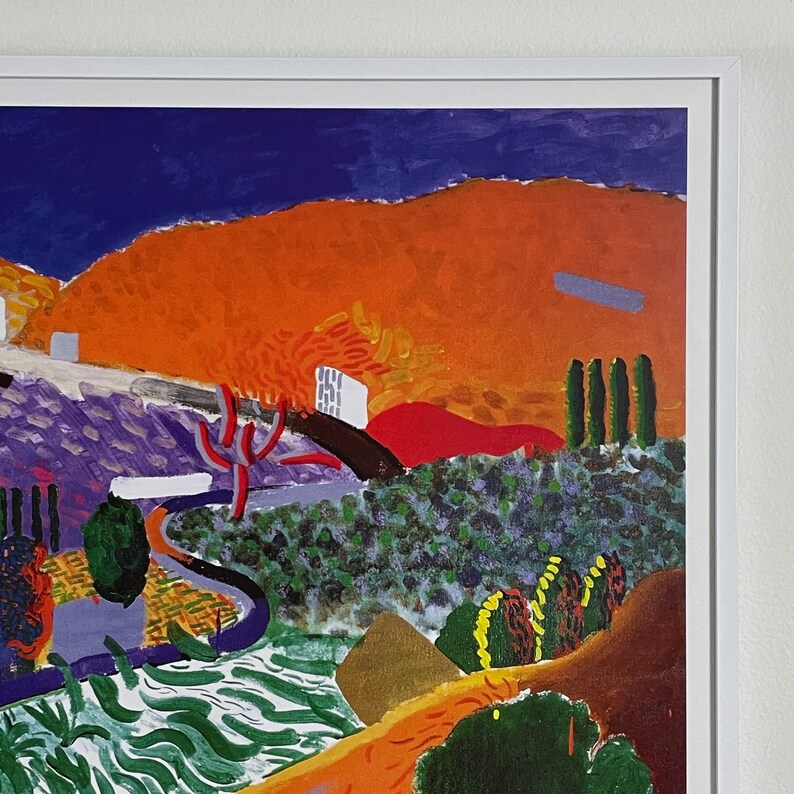 May include: A colorful abstract painting with a landscape scene. The painting features a bright orange hill with a purple and green valley in the foreground. The sky is a deep blue with a few white clouds.