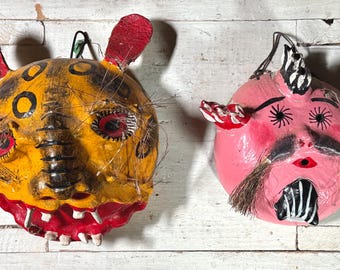 Par de máscaras de arte popular mexicano vintage talladas en coco/jaguar