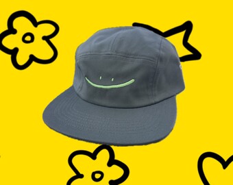 green smiley five panel hat