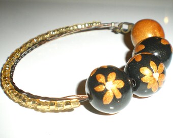 Black and gold asymmetrical beaded bracelet
