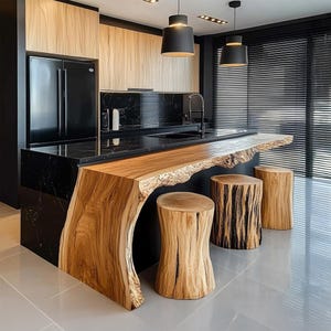 May include: Contemporary kitchen with a black marble worktop and a natural wood island with a live edge. Includes three wooden stools and black pendant lights. The kitchen also has black cabinets and a black fridge.