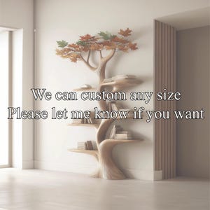 May include: A unique, wooden tree-shaped bookshelf with multiple shelves holding books. The top of the bookshelf features metal leaves in shades of green, orange, and brown. The text on the image reads: "We can custom any size. Please let me know if you want."