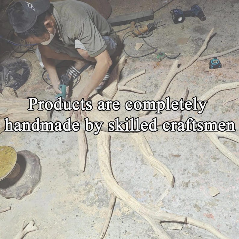 May include: A craftsman working on a wooden sculpture, using a power tool. The image shows the text "Products are completely handmade by skilled craftsmen". The sculpture is made of light-colored wood.