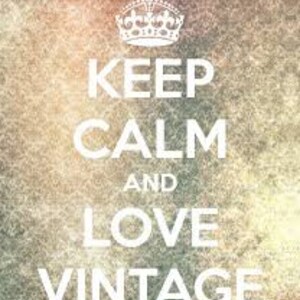 May include: A vintage-inspired graphic with a crown and the text "Keep Calm and Love Vintage". The background is a faded, textured image with shades of orange, yellow, and pink.