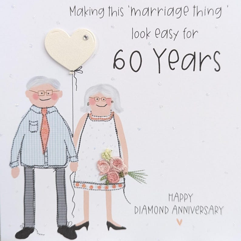 May include: A greeting card featuring an illustration of an older couple with gray hair and glasses. The text reads, Making this 'marriage thing' look easy for 60 Years, and Happy Diamond Anniversary. A cream heart balloon and pink flowers are included.