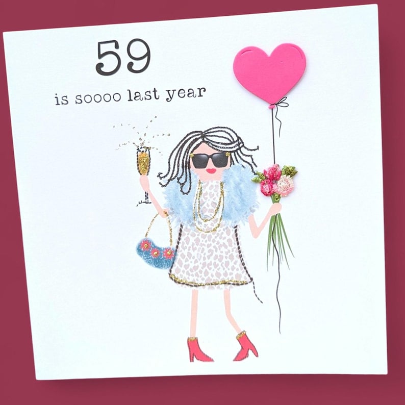 May include: A white card with a black and white illustration of a woman wearing sunglasses, a blue fur coat, a leopard print dress, red shoes, and holding a glass of champagne and a bouquet of pink flowers. The card also has a pink heart balloon and the text "59 is soooo last year".