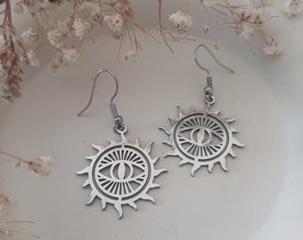 Pretty pair of sun and protective eye earrings