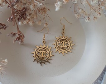 Pretty pair of sun and protective eye earrings