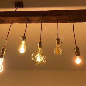 Antiqued beam chandelier with vintage LED pendant lamps with double direct and indirect lighting