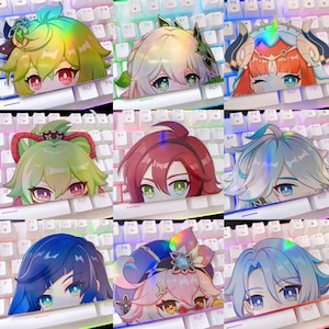 May include: Set of ten holographic keyboard keycaps featuring anime characters with colorful hair and eyes. The keycaps are designed to fit standard mechanical keyboards.
