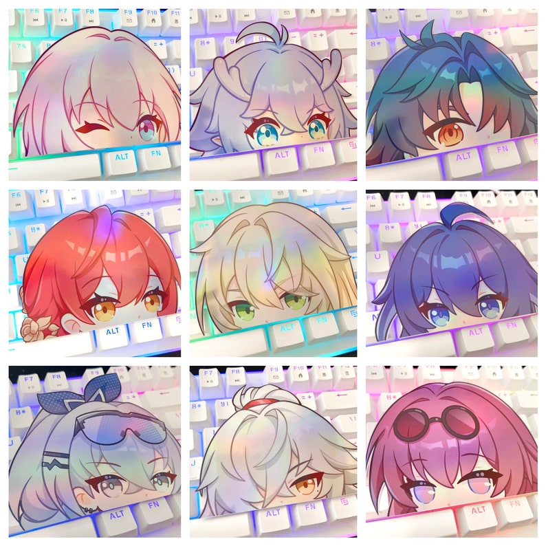 May include: Nine anime-style character stickers, each with a unique hairstyle and eye color, peeking over a white keyboard. The keyboard has colorful LED backlighting. The stickers are in various colors, including pink, blue, and green.