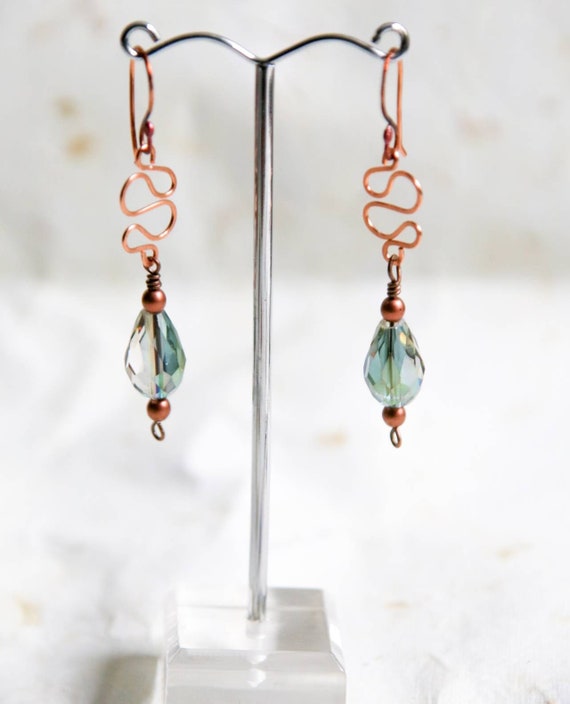 Sparkly faceted glass beads on  hammered copper earrings and copper earwires.